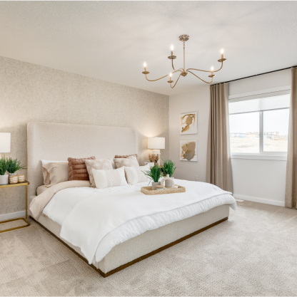 Bedroom with a king size bed, a window with floor to ceiling curtains and modern glamour decor.