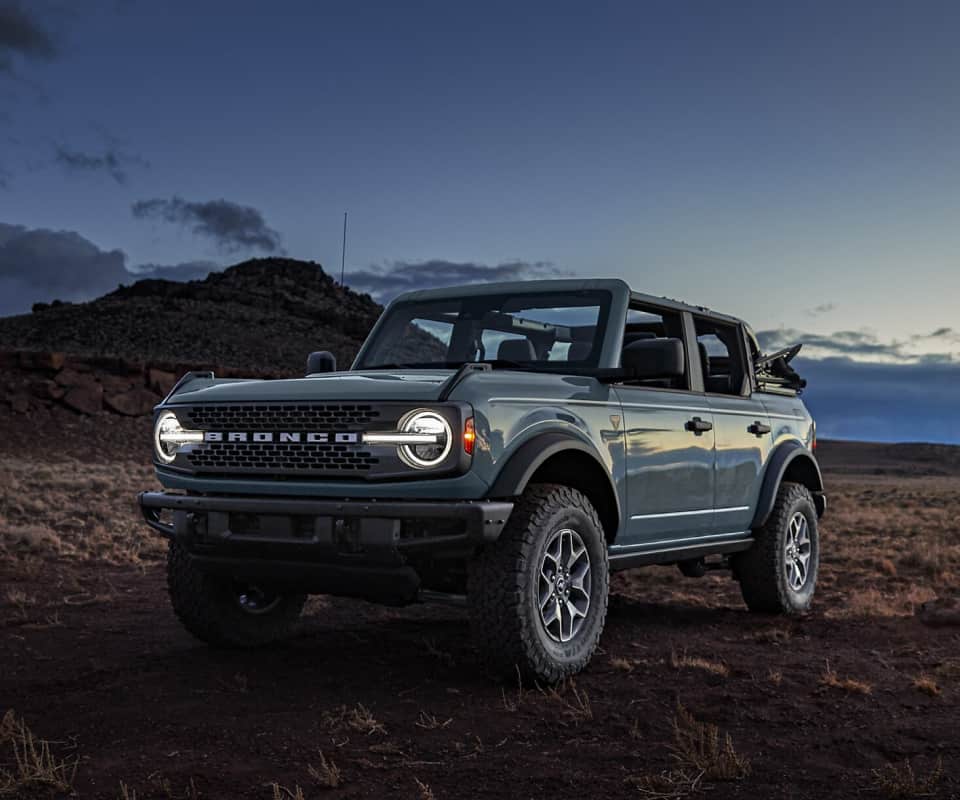 Iconic Ford Bronco parked in a rugged outdoor setting, ready for adventure